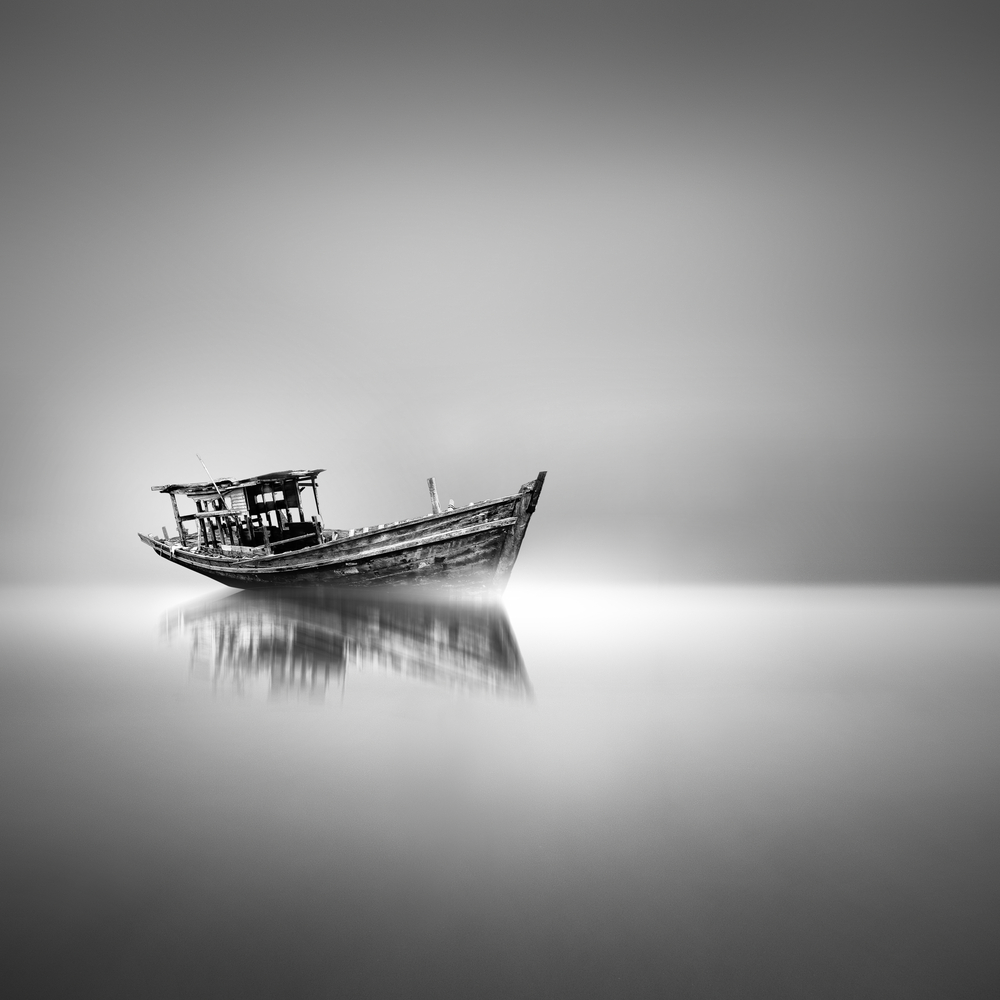 abandoned boat in the water, long exposure, BW