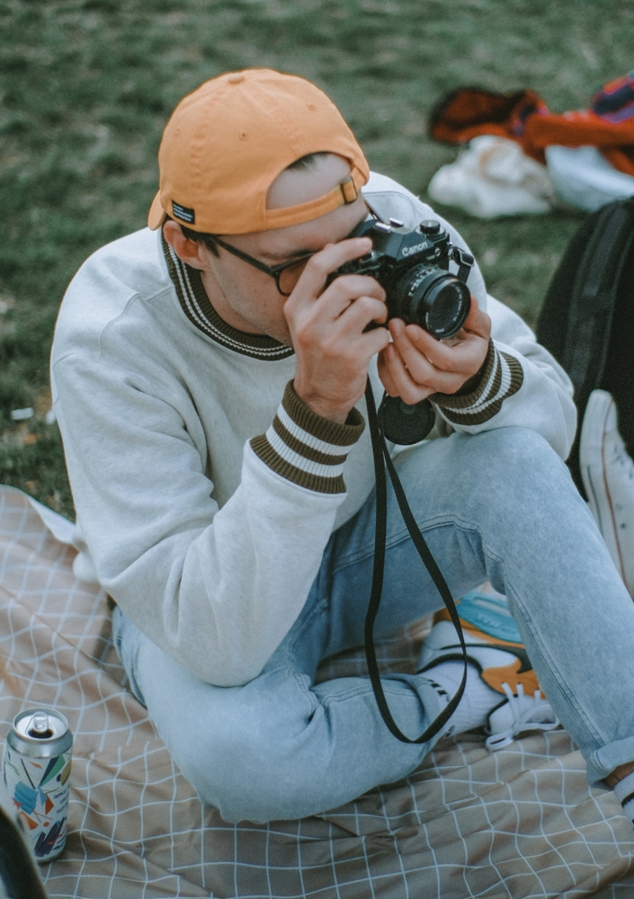 Man taking picture at a park