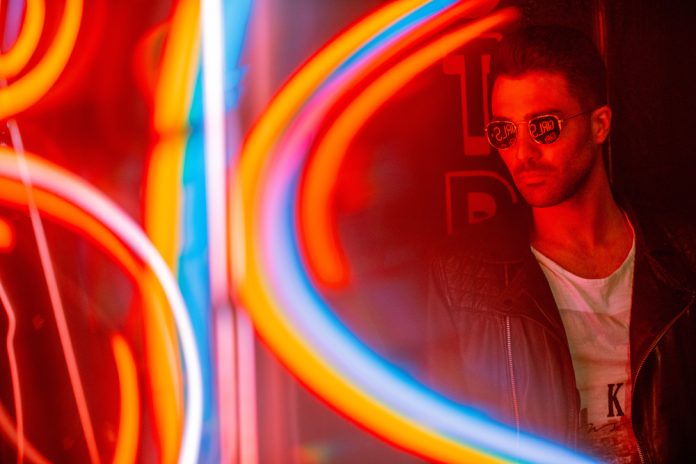 man with sunglasses and neon light