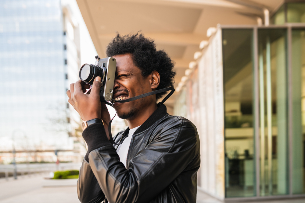 Photographer focusing his camera