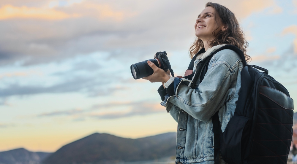 Photographer smiling and looking at the sunset