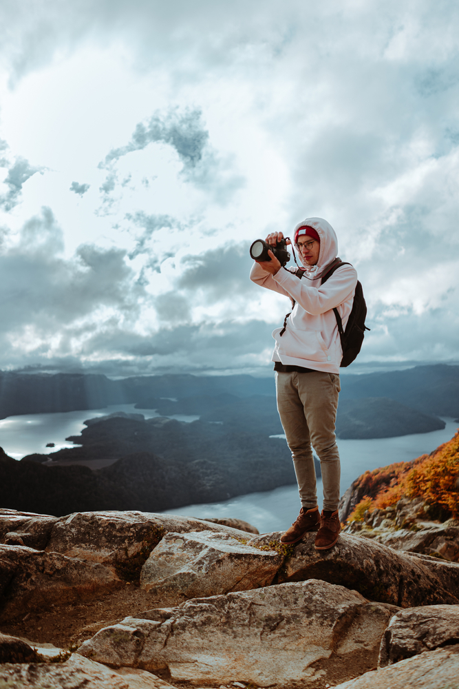 Photographer standing on a cliff