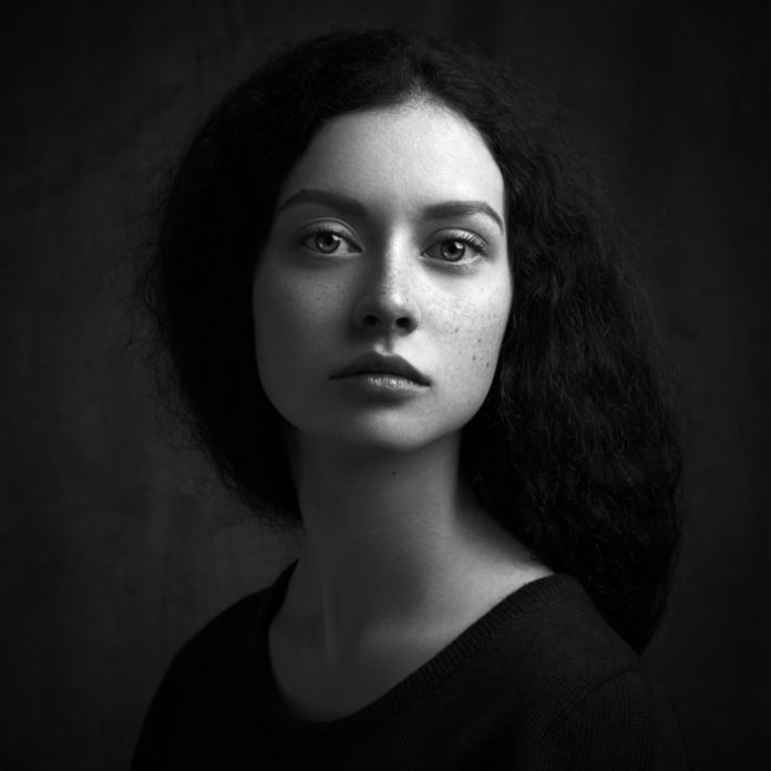 portrait of a girl with freckles BW