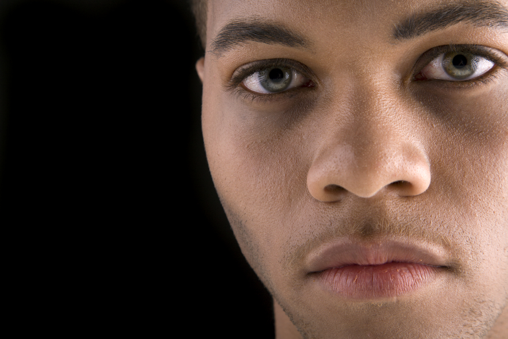 Portrait of a handsome young black man focused on his eyes