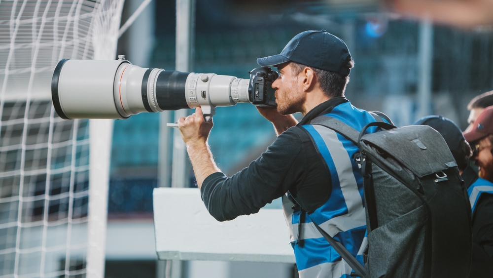 Professional Sports Photographer with Big Lens